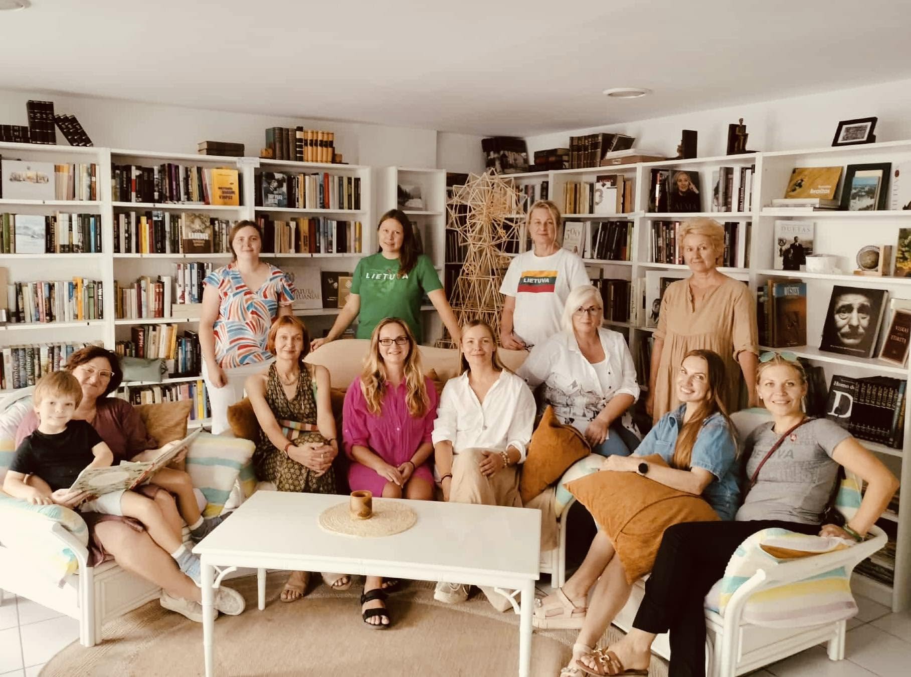 Group portrait of the community gathered in the library
