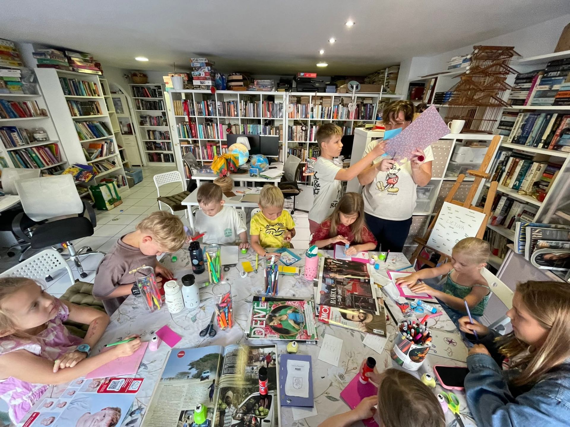 Children's creative workshop with crafts and magazines