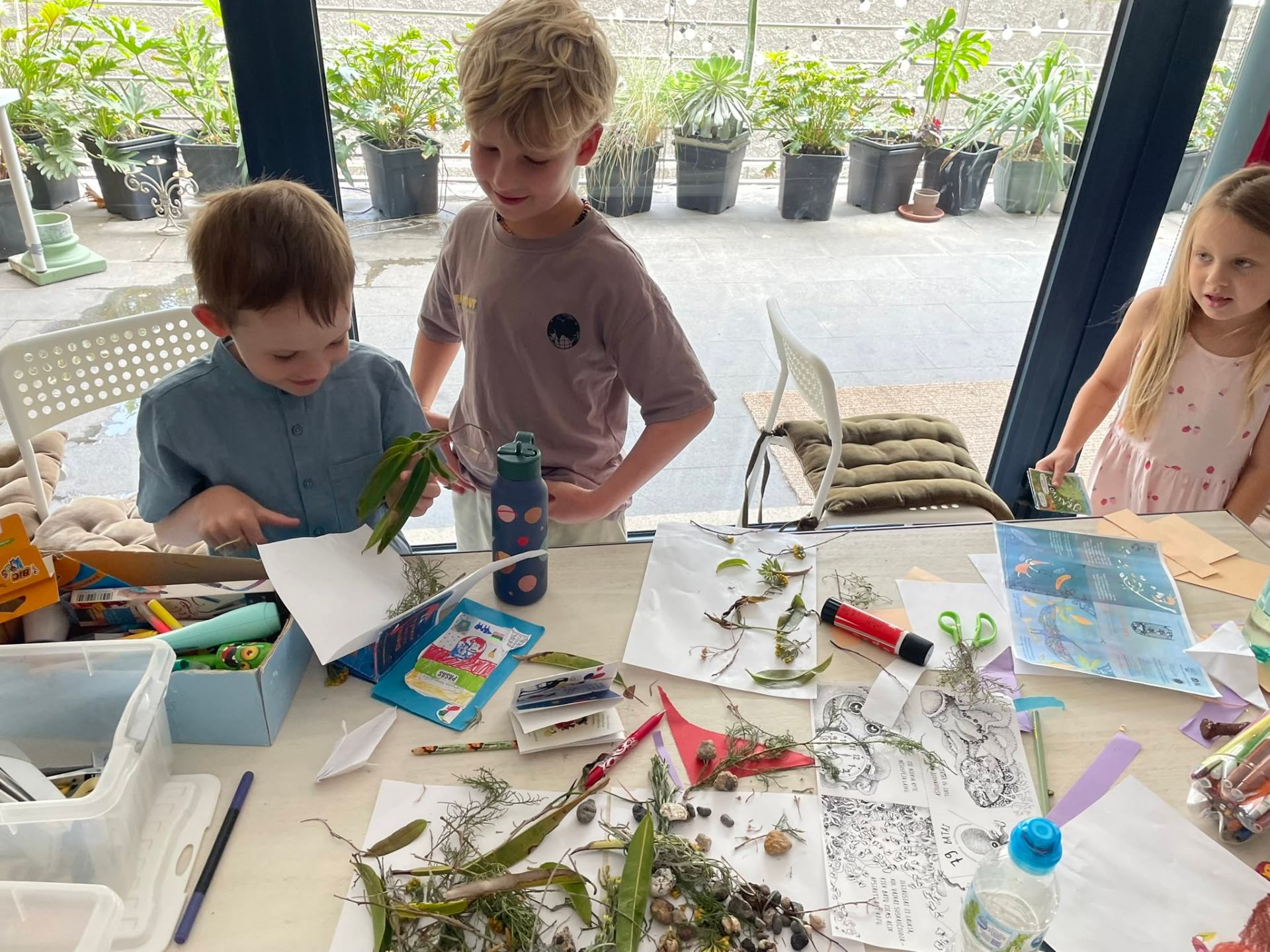 Children exploring nature crafts at the library