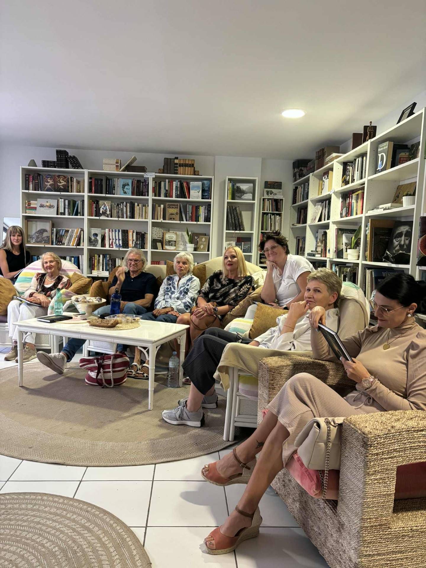 Adult book club gathering in the library lounge
